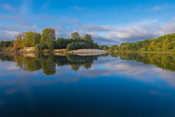 Fototapeta premium reflection of trees in lake