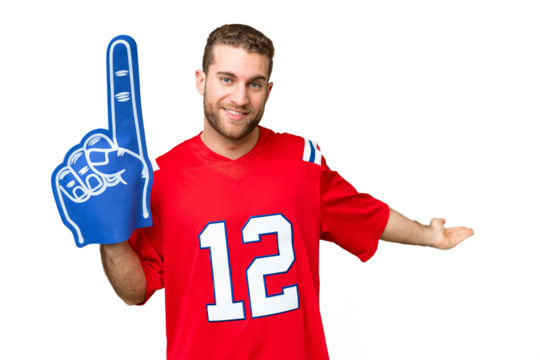 sports fan man over isolated chroma key background extending hands to the side for inviting to come