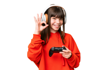 Little caucasian girl playing with a video game controller over isolated background showing ok sign with fingers