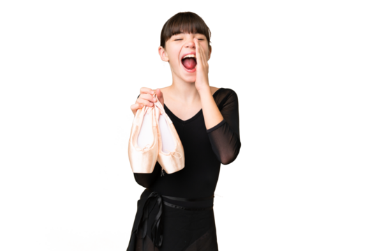Little caucasian girl practicing ballet over isolated background shouting with mouth wide open
