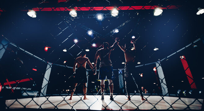 Sport MMA banner, referee raises hand to fighter winner of fights without rules in cage octagon