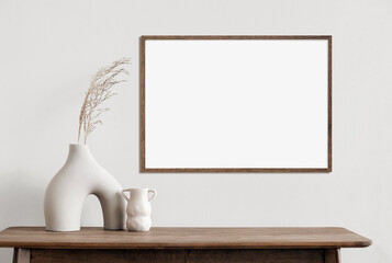 Fototapeta Blank wooden picture frame mockup on wall in modern interior. Horizontal artwork template mock up for artwork, painting, photo or poster in interior design obraz