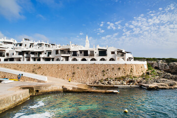 Binibeca town, Menorca island, Spain, Beautiful view of old town with the sea
