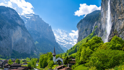 amazing alpine valley in Lauterbrunnen village in Switzerland - 580011531