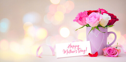 Mug with a heart, bouquet of roses and a tag with a text Happy Mothers Day