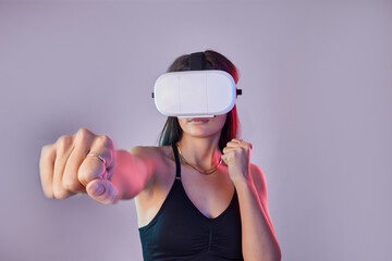 Vr, fitness and woman boxing in metaverse studio isolated on a purple background mockup. 3d exercise, virtual reality and female fighting or punching with futuristic technology for esports gaming.