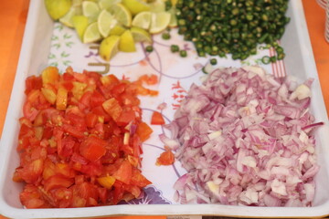raw minced  onion , tomato   lemons , and green chilli  with vegetables