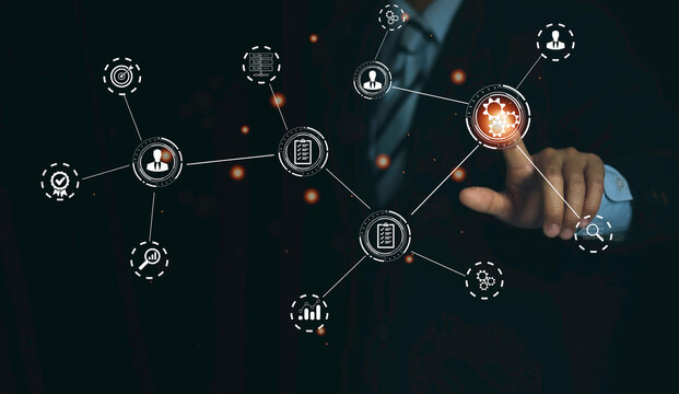 technology business, manager touching gears icons. operations system management involving business process and workflow, problem solving, monitoring and evaluation, quality control. high performance,