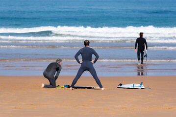 Surfers preparing to enter the sea