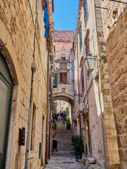 Charming and picturesque narrow steep alley with stone steps in Dubrovnik Old Town. Croatia, Europe