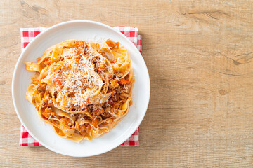 Homemade pasta fettuccine bolognese with cheese