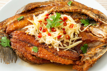 Fried Sea Bass Fish with Fish Sauce and Spicy Salad