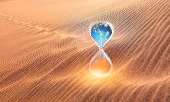 Global warming concept-Planet Earth is becoming a dead planet like Mars - Hourglass inside Planet Earth and Mars isolated- sand dune "Elements of this image furnished by NASA"