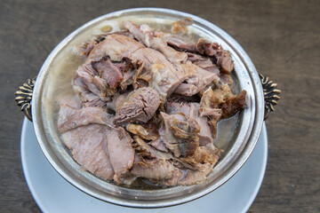Plate of lamb meat slowly cooked in tandir clay oven in Turkey.