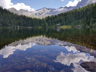 The Reedsee lake (1831m), surrounded by ancient mountain forest, is located in a picturesque glade at the foot of Tischler group at Gastein valley, Austrian Alps