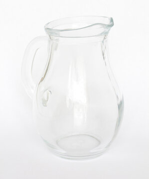 Empty clear glass jug on white background