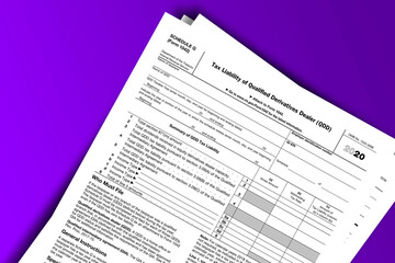 Obraz premium Form 1042 (Schedule Q) documentation published IRS USA 10.15.2020. American tax document on colored