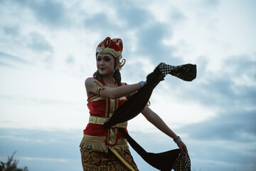 portrait young women presenting traditional Javanese dance movements