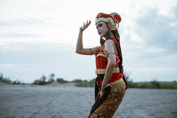 portrait young women presenting traditional Javanese dance movements