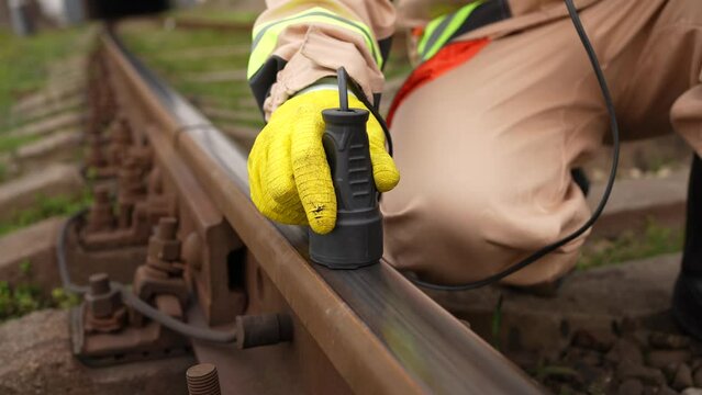 engineer worker search for defects in railway sleepers and steel rails