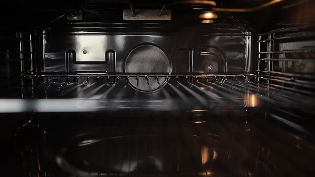 empty oven inside. Electric home kitchen oven open door slider panning shot. Oven. Convection inside stove. horizontal orientation video