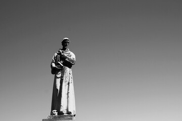 A statue of Saint Joseph in black and white.