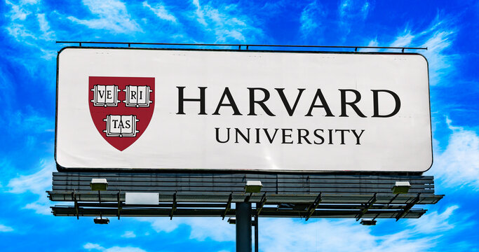 Advertisement billboard displaying logo of Harvard University