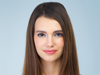 Naklejka premium Skincare, beauty and portrait of woman with smile on blue background for wellness, facial and spa treatment. Salon aesthetic, dermatology and face of happy girl with cosmetics, makeup and hair care