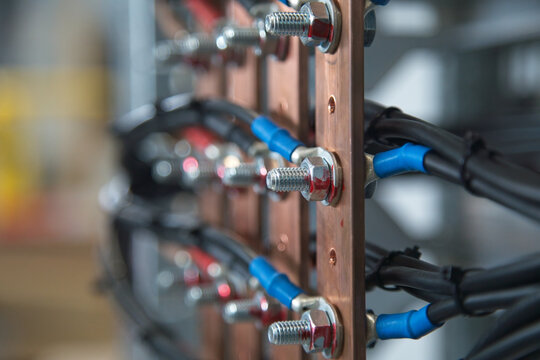 Closeup of electrical wires in copper busbars