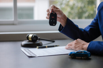 car auction concept Lawyer working at a table in a court of law The concept of selling a car by...