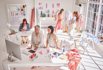 Clothes production, designer and women working on fashion, fabric and textile planning work....