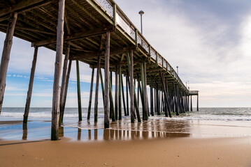 The view of the beautiful Atlantic Ocean and fishing pier in Ocean City, Maryland. - obrazy, fototapety, plakaty