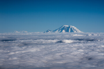 Fototapeta na wymiar Mountain over the clouds