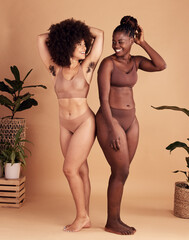 Diversity, body and natural with black woman friends in studio on a beige background for beauty or equality. Health, wellness and armpit hair with a model female and friend posing in underwear