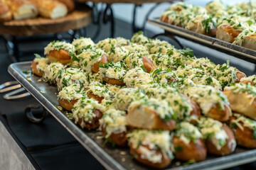 coffee break hotel during conference meeting, corporate revent with tea and coffee catering, decorated catering banquet table with variety of different pastry and bakery, with croissants and cookies