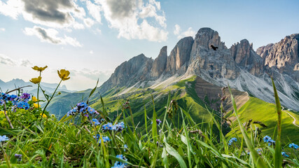 Summer landscape of  italian mountains (Dolomites), vivid scenery with alpine meadow and dynamic clouds
