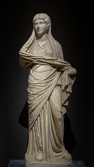 Woman marble statue from ancient Perge city. Statue of Roman aristocratic woman (Plancia Magna) in traditional dress. Antalya, Turkey.