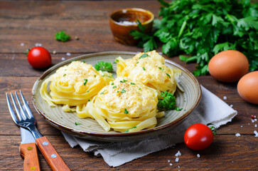 Pasta Nests with Creamy Sauce on a Plate, Freshly Cooked Pasta, Tasty Food