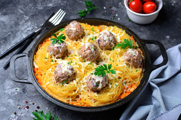 Obraz na płótnie Canvas Pasta Nests with Meatballs and Tomato Sauce on a Plate, Freshly Cooked Pasta, Tasty Food