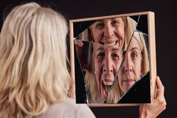 Bipolar woman, broken mirror or reflection of anxiety, depression or psychology, identity crisis or...
