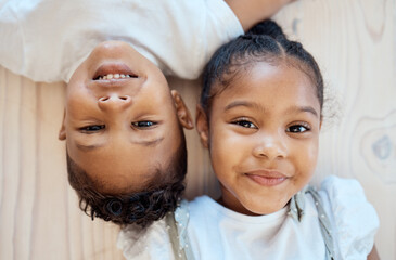 Family friends, smile and children portrait of siblings with happiness, bonding and love at home. Faces of happy kids together above view of brother and sister care and young friendship in house