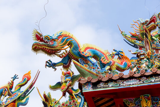Chinese style temple with dragon statue on roof tile