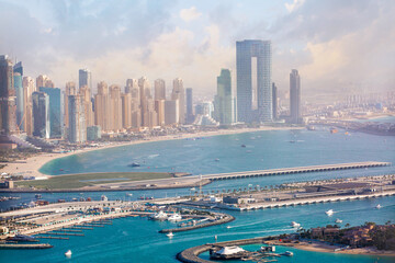 Fototapeta na wymiar Dubai marina view with white sand beaches and skyscrapers