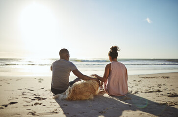Fototapeta Relax, dog and happy with couple at beach for peace, summer and sunset vacation. Love, support and travel with man and woman with pet by ocean for nature, health and date or holiday together obraz