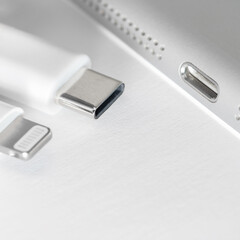 View of apple device with both usb-c and lightning cable charger. Eu forced Apple iphone to Use...