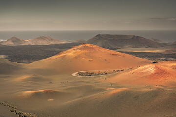 Fototapeta na wymiar The amazing volcanic landscape of Timanfaya National Park in Lanzarote, Canary Islands, Spain