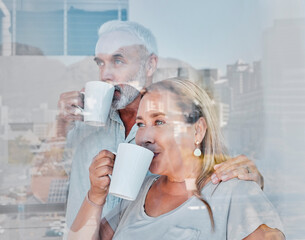Elderly couple, hug and drinking coffee by window of the city with a vision for morning routine at home. Senior man and woman relaxing looking out glass at urban town view together with warm mug