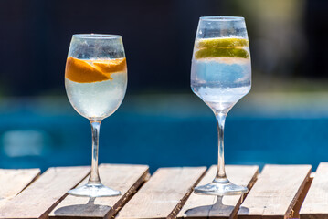Two glasses of water with a lemon slice on the bottom