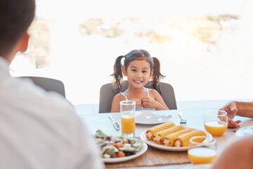 Child, girl or family lunch meal at dining table for holiday celebration, reunion or social gathering. Portrait, smile or happy kid with healthy food in house, home or restaurant and bonding at party