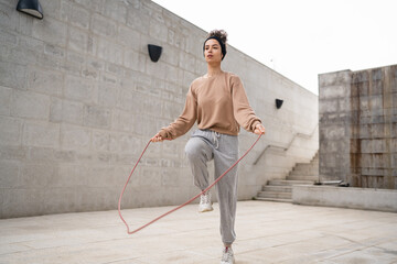 one woman young adult caucasian female with jumping rope training